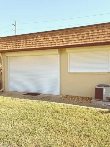 yard and central AC unit