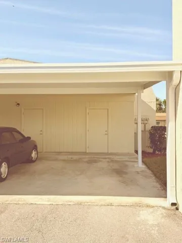 View of carport and storage closet