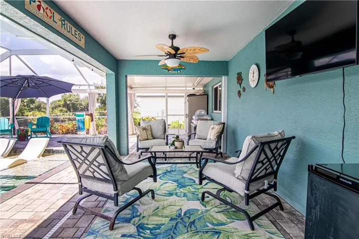 Sunroom / solarium featuring plenty of natural light and ceiling fan