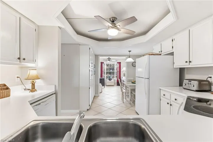 Kitchen opens to den and living room