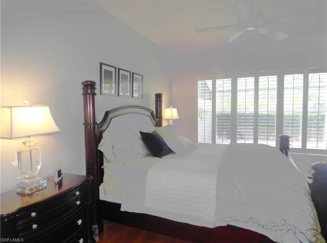 Bedroom w/shutters laminate floor