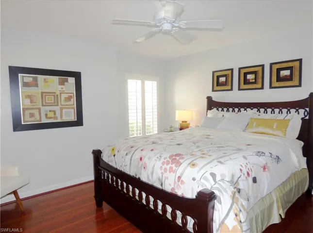 Bedroom w/shutters laminate floor