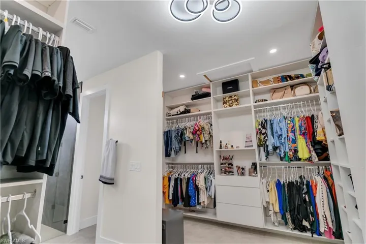 Walk in closet with visible vents