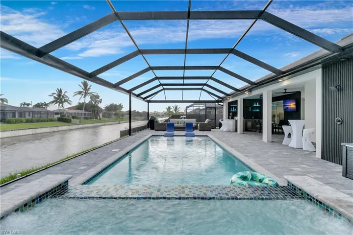 Outdoor pool featuring an outdoor living space, ceiling fan, a lanai, and a patio
