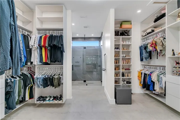 Walk in closet with tile patterned floors