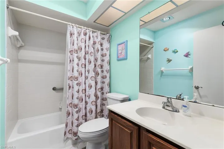 Full bathroom with vanity and shower / tub combo