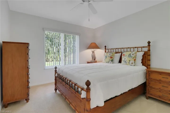 Guest Bedroom featuring ceiling fan and light carpet