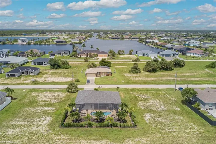 Aerial view of residential area featuring a nearby body of water "Crystal Lake"
