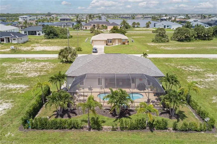 Aerial view of residential area featuring a pool area