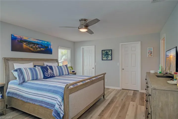 Bedroom featuring light wood-type flooring and ceiling fan