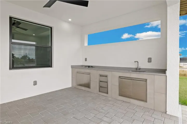 View of terrace with sink and exterior kitchen