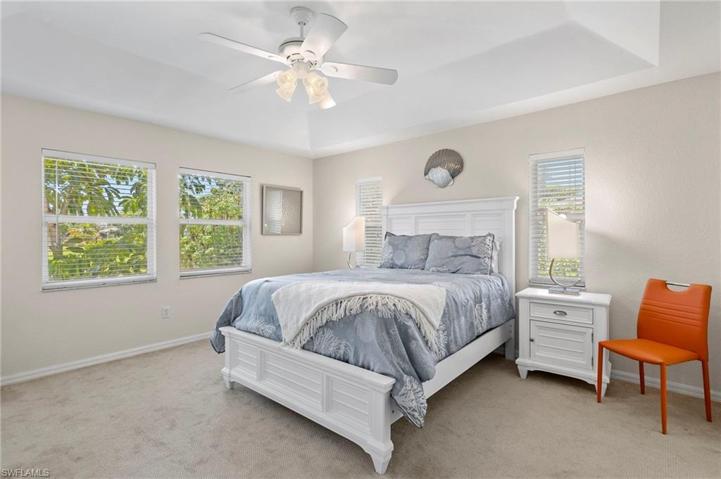 Main Bedroom with tray ceiling, lanai access