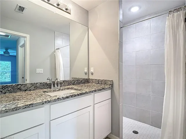 Primary bedroom ensuite bath with step in shower.