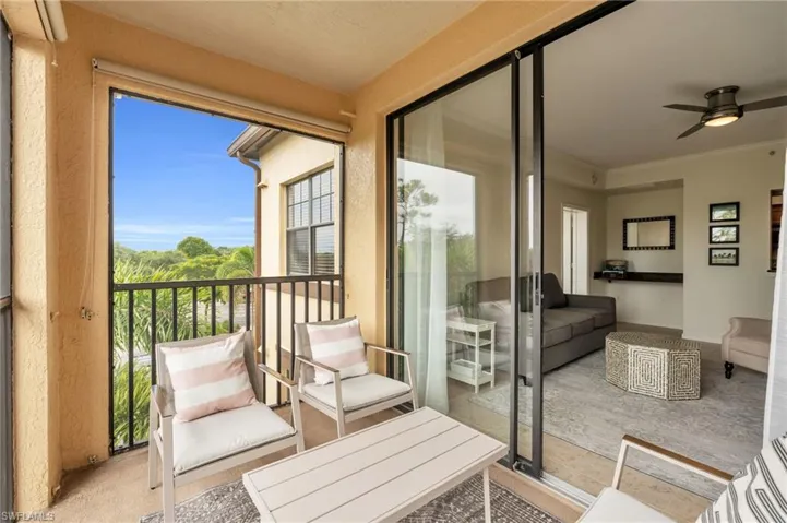 Balcony featuring ceiling fan