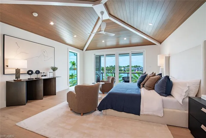 Bedroom featuring light wood-style flooring, recessed lighting, lofted ceiling, access to outside, and wooden ceiling