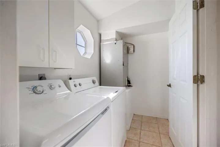 A convenient Laundry Room tucked away next to the Garage