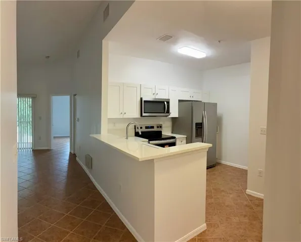 breakfast bar and nook area for small table/chairs