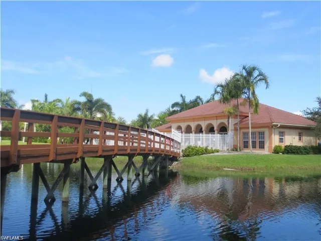 bridge across pond to the clubhouse and pool