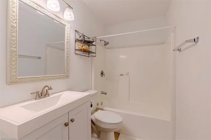 Bathroom with vanity and tub / shower combination