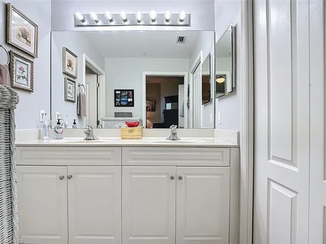 Full bath featuring double vanity