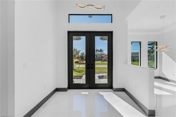 Entrance foyer featuring french doors
