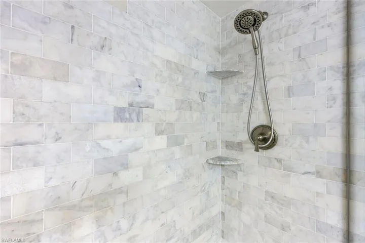 Bathroom view of a tile shower