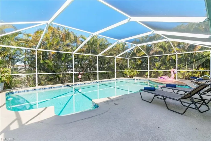 Pool with a lanai and a patio