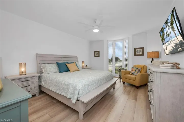 Primary Bedroom featuring Light Wood-Style LVP Floors and a Ceiling Fan