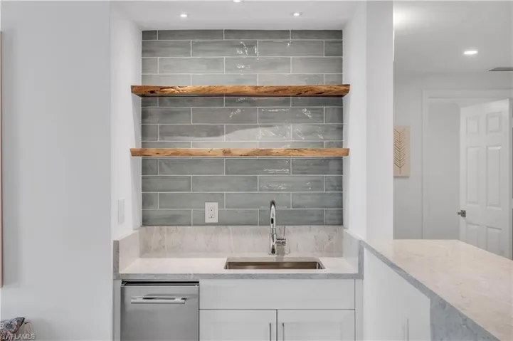 All NEW Wet Bar Area Featuring Live Edge Wood Open Shelves, Beautiful Quartz Counters, White Cabinets, Sink, Wine Fridge & Icemaker
