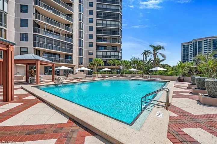 Community Pool Featuring a Gazebo and a Patio Area