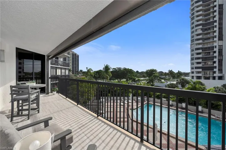 Balcony Featuring View of Pool Area