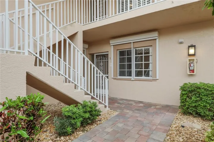 View of exterior entry featuring stucco siding