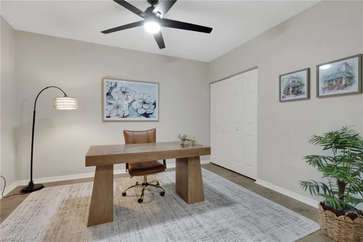 Office featuring light wood-type flooring and ceiling fan