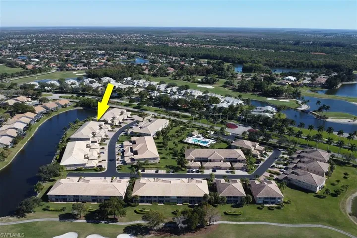 View of property location featuring a nearby body of water and nearby suburban area