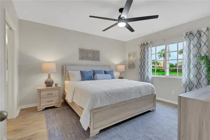 Bedroom featuring light wood-style floors and ceiling fan