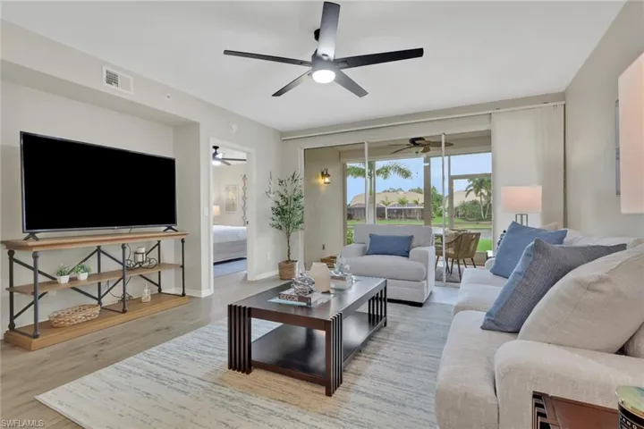 Living area with light wood-style flooring and baseboards