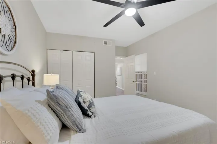 Bedroom featuring ceiling fan and a closet