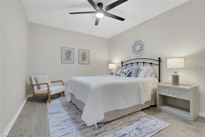 Bedroom featuring a ceiling fan and light wood-type flooring