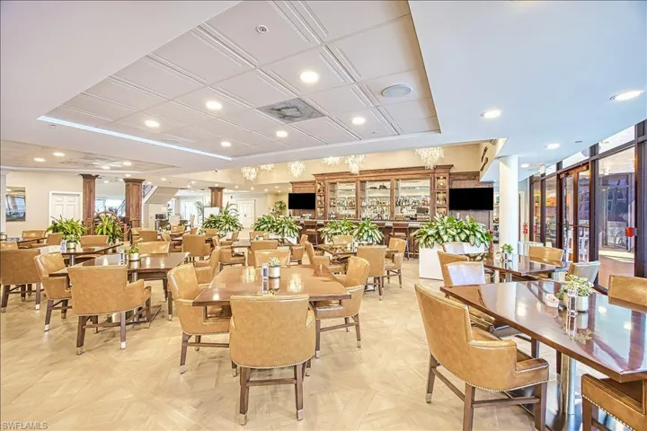 Dining area with decorative columns, plenty of natural light, and recessed lighting