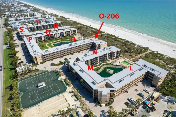 Bird's eye view featuring a water view and a view of the beach