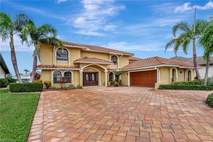 Mediterranean / spanish-style home featuring a garage