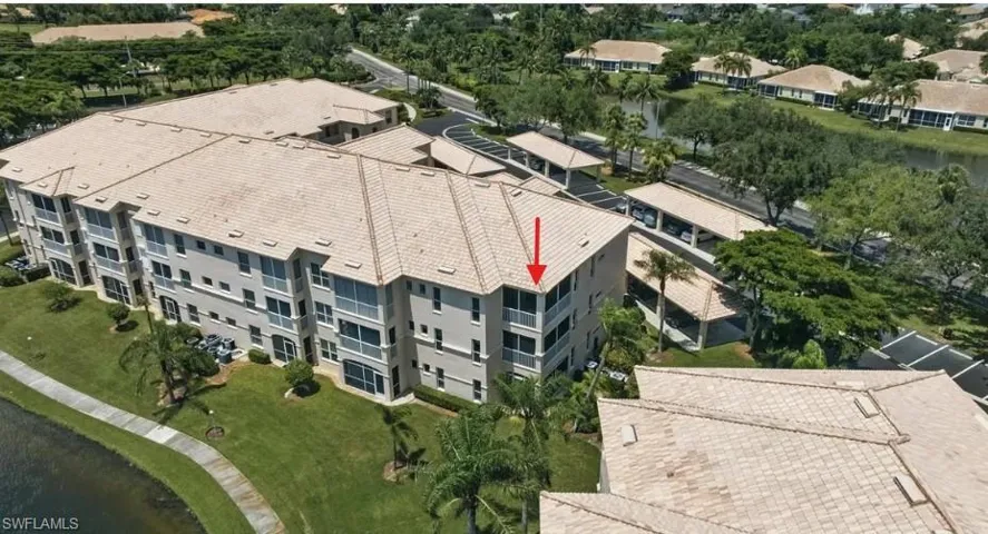 Bird's eye view of apartment complex / building and a nearby body of water