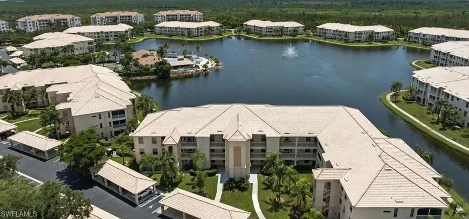 Aerial view of apartment complex and a large body of water
