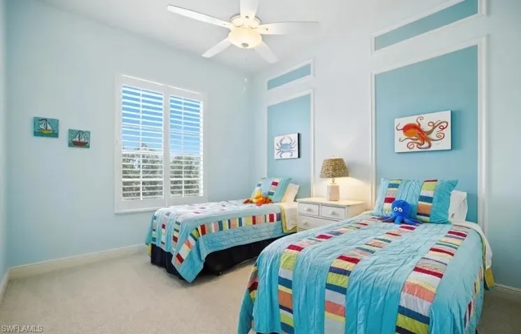 Bedroom with carpet and a ceiling fan