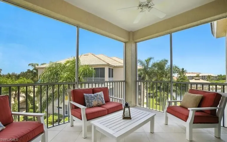 Sunroom / solarium with a balcony, an outdoor hangout area, and a ceiling fan