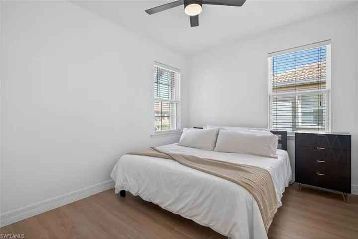 Bedroom featuring wood finished floors and a ceiling fan