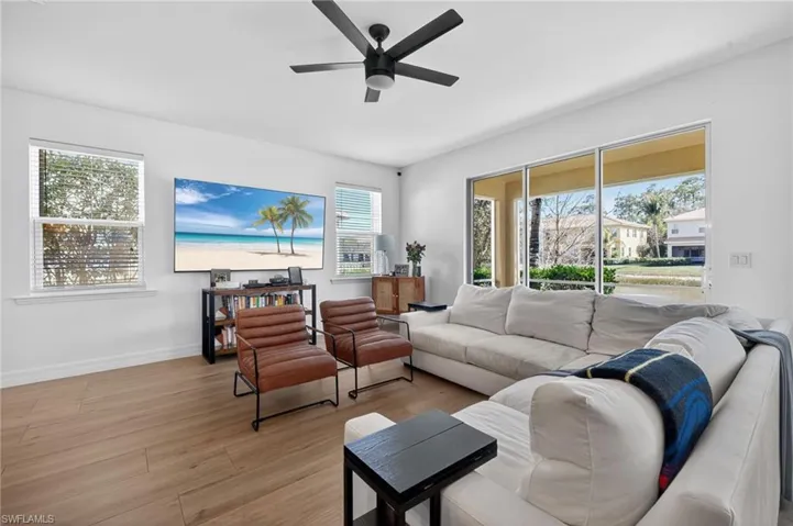 Living area featuring wood finished floors and ceiling fan