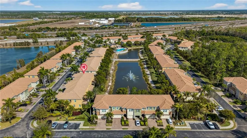 Aerial perspective of suburban area with a nearby body of water