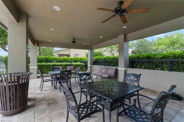 View of patio featuring outdoor dining space and ceiling fan