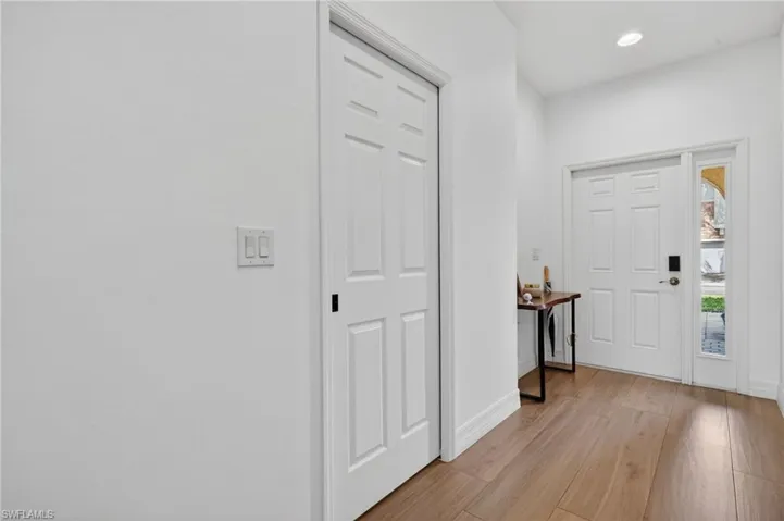 Entryway featuring light wood-style floors and recessed lighting